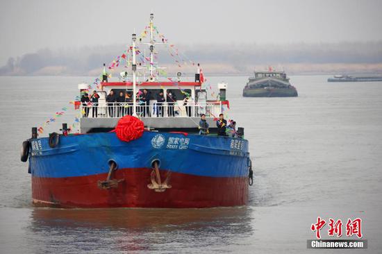 Electricity-powered cargo ship with super capacity makes maiden voyage