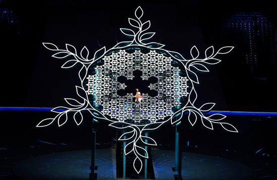 Torchbearer Li Duan sets the torch into the Paralympic Winter Games Cauldron during the opening ceremony of the Beijing 2022 Paralympic Winter Games at the National Stadium in Beijing, capital of China, March 4, 2022. (Xinhua/Yan Yan)