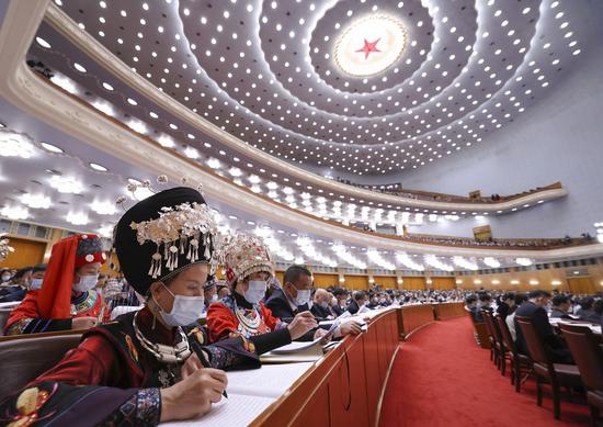 Deputies attend the opening meeting of the fifth session of the 13th National People's Congress (NPC) at the Great Hall of the People in Beijing, capital of China, March 5, 2022. (Xinhua/Liu Weibing)