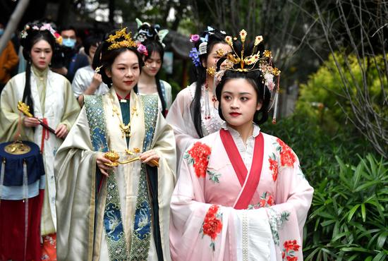 Young women in traditional Chinese Hanfu celebrate Huachao Festival