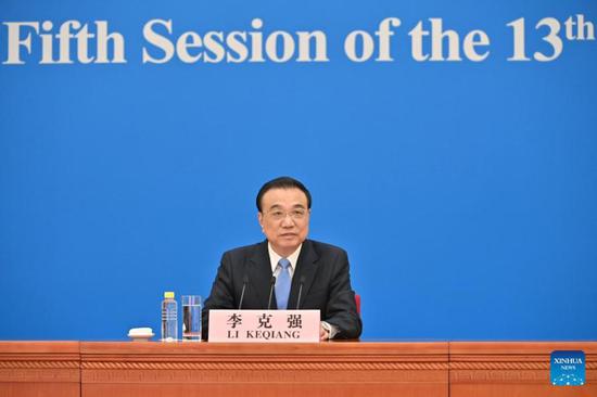 Chinese Premier Li Keqiang meets the press after the closing of the fifth session of the 13th National People's Congress (NPC) in Beijing, capital of China, March 11, 2022. Li took questions from Chinese and foreign journalists via video link. (Xinhua/Li Xin)