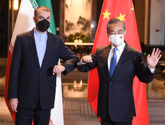 Chinese State Councilor and Foreign Minister Wang Yi meets with Iranian Foreign Minister Hossein Amir Abdollahian in Wuxi, East China's Jiangsu province in this Jan 14, 2022 file photo. (Photo/Xinhua)
