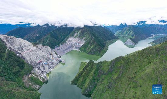 Aerial photo taken on July 15, 2021 shows a view of Lianghekou hydropower plant on the Yalong River in Tibetan Autonomous Prefecture of Garze, southwest China's Sichuan Province. This mega hydropower plant built at an average altitude of 3,000 meters, the highest one of its kind in China, went into operation on Wednesday. The first two 500,000-kW power generation units went operational at the plant, marking the operation of the plant with a planned total installed capacity of 3 million kW. (Xinhua)