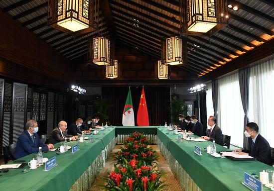 Chinese State Councilor and Foreign Minister Wang Yi holds talks with Algerian Foreign Minister Ramtane Lamamra in Tunxi, east China's Anhui Province, March 20, 2022. (Xinhua/Zhou Mu)