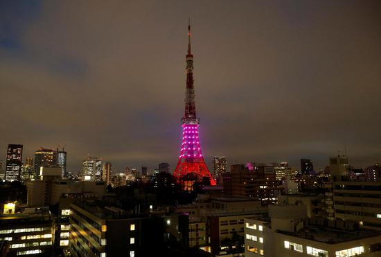 Tokyo Tower half illuminated to save power