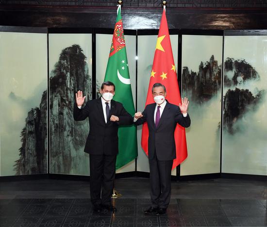 Chinese State Councilor and Foreign Minister Wang Yi meets with Turkmen Deputy Prime Minister and Foreign Minister Rashid Meredov on the sidelines of the third foreign ministers' meeting of neighboring countries of Afghanistan, in Tunxi, east China's Anhui Province, March 30, 2022. (Xinhua/Zhou Mu)
