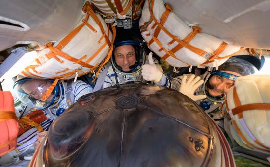 NASA astronaut Mark Vande Hei (left), Russian cosmonauts Anton Shkaplerov (center) and Pyotr Dubrov are seen inside their Soyuz MS-19 spacecraft after landing in a remote area near the town of Dzhezkazgan, Kazakhstan, March 30, 2022. (Photo credit: NASA)