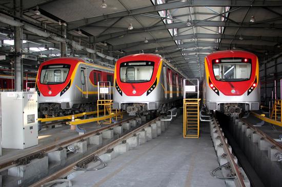 The Orange Line metro trains are seen at the terminal station in Lahore, Pakistan, Dec. 29, 2021.  (Photo by Jamil Ahmed/Xinhua)