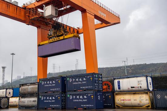 A bridge crane operates at Guoyuan Port in Chongqing, southwest China, Feb. 19, 2022. (Xinhua/Tang Yi)