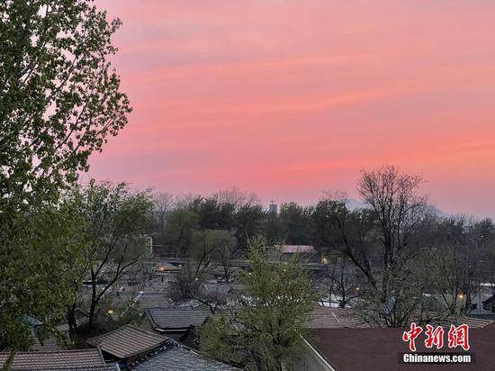 Majestic pink-orange sunset glows over Beijing