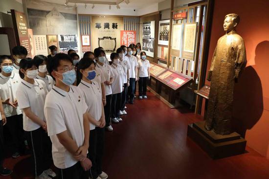 Students from a middle school visit an exhibition commemorating the founding of the Communist Party of China at the 