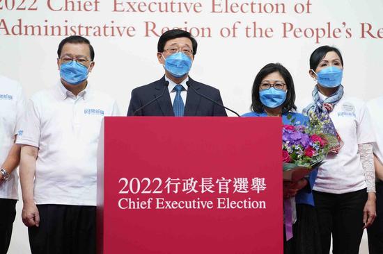 John Lee (2nd L) attends a press conference in Hong Kong, south China, May 8, 2022. John Lee was elected as the Hong Kong Special Administrative Region's sixth-term chief executive designate on Sunday. (Xinhua/Lui Siu Wai)