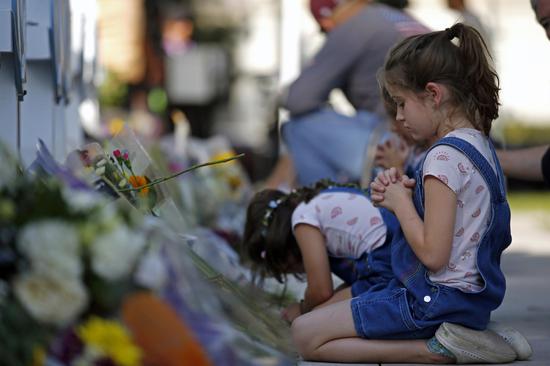People mourn victims of elementary school shooting