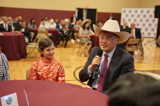 The Chinese ambassador to the United States Qin Gang meets American students who are learning Chinese at the International Leadership of Texas at Garland High School on Tuesday. (Photo by MINLU ZHANG / for chinadaily.com.cn)