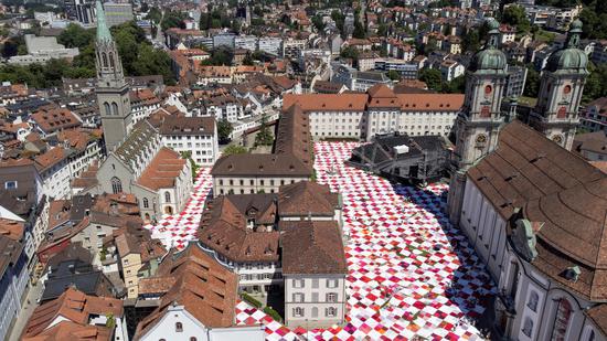 Artists build giant picnic blanket in Swiss