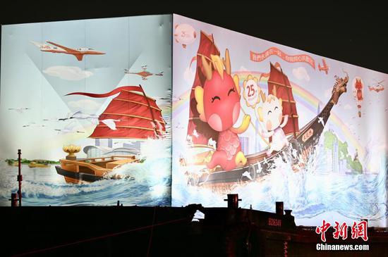 Giant 3D art painting lights up to celebrate Hong Kong's return
