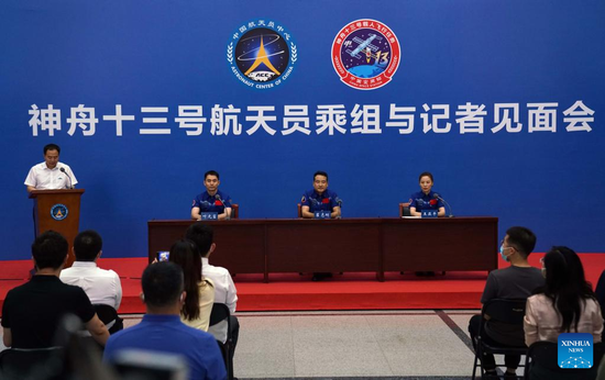 Jing Haipeng (1st L), head of the Astronaut Corps, describes the Shenzhou-13 crew's recovery and follow-up plans at a press conference in Beijing, June 28, 2022. (Xinhua/Guo Zhongzheng)
