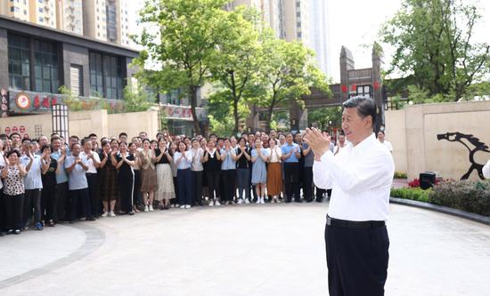 Chinese President Xi Jinping, also general secretary of the Communist Party of China Central Committee and chairman of the Central Military Commission, communicates with residents at a residential community in Wuhan, capital of central China's Hubei Province, June 28, 2022. (Xinhua/Ju Peng)