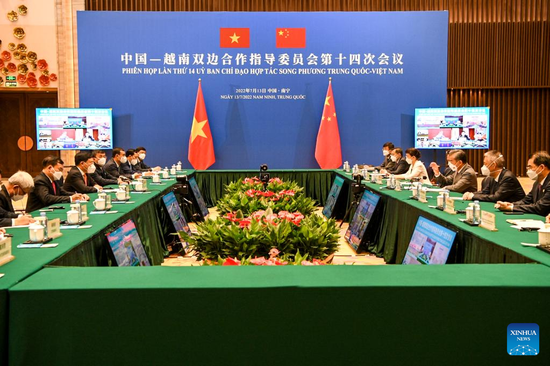 Chinese State Councilor and Foreign Minister Wang Yi and Vietnamese Deputy Prime Minister Pham Binh Minh co-chair the 14th meeting of the China-Vietnam Steering Committee for Bilateral Cooperation in Nanning, south China's Guangxi Zhuang Autonomous Region, July 13, 2022. (Xinhua/Cao Yiming)