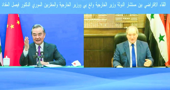 Chinese State Councilor and Foreign Minister Wang Yi meets with Syrian Foreign Minister Faisal Mekdad via video link, July 15, 2022. (China's Ministry of Foreign Affairs/Handout via Xinhua)