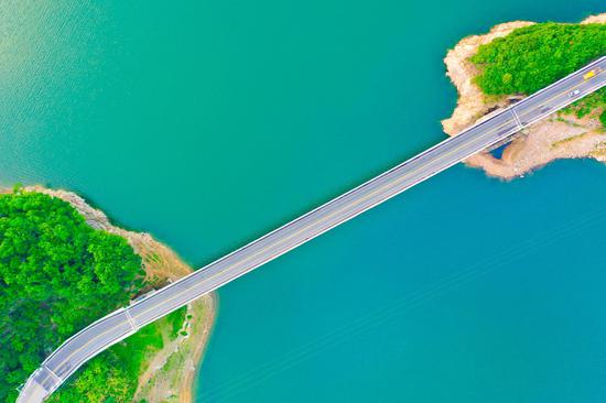Aerial view of Jinzhai bridge across Meishan Reservoir in Anhui