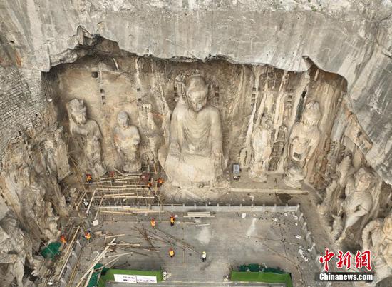 Restored giant Buddha statue of Lushena unveiled in Longmen Grottoes