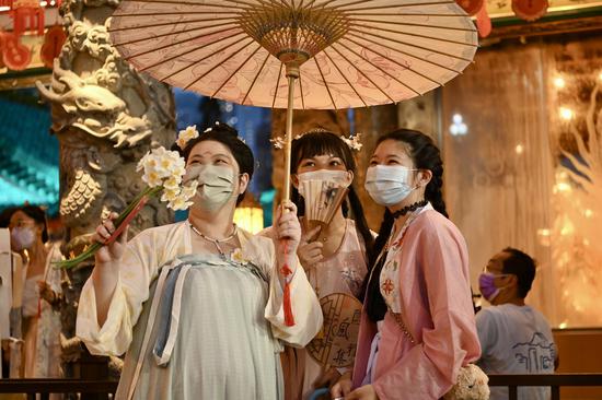 People in traditional Chinese costumes celebrate Qixi in Hong Kong