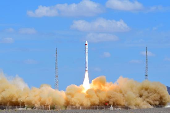 China launches three satellites in one rocket