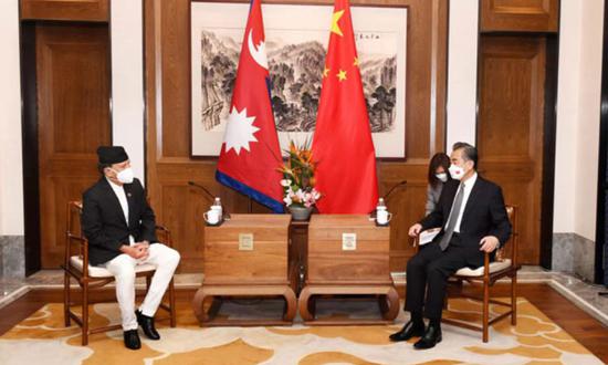 Chinese State Councilor and Foreign Minister Wang Yi (right) talks with visiting Nepali Foreign Minister Narayan Khadka in Qingdao, East China's Shandong Province on August 10, 2022. (Photo/mfa.gov.cn)