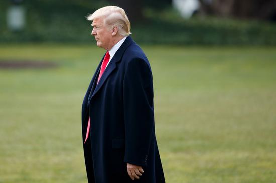 Then U.S. President Donald Trump walks on the South Lawn heading for the Marine One departing from the White House in Washington D.C., the United States, on March 29, 2018. (Photo: Xinhua/Ting Shen)