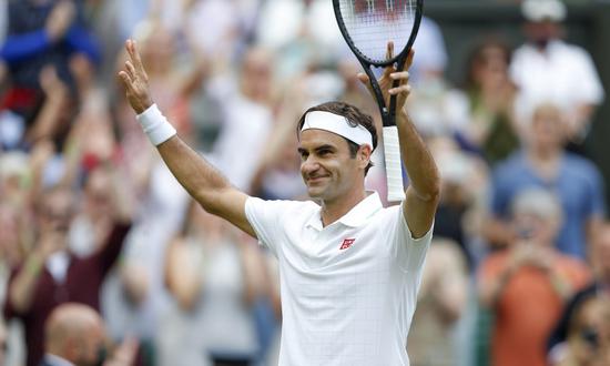 Roger Federer of Switzerland celebrates after the men's singles third round match against Cameron Norrie of Britain at Wimbledon tennis Championship in London, Britain, July 3, 2021. (Xinhua/Han Yan)