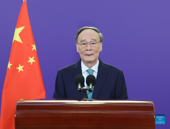 Chinese Vice President Wang Qishan makes a keynote speech while attending the commemorative event for the International Day of Peace 2022 via video link on Sept. 21, 2022. (Xinhua/Wang Ye)