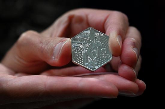 Special hexagonal commemorative coin for 2024 Paris Olympics unveiled