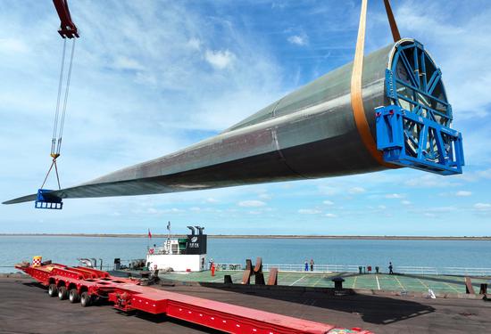 World's longest wind turbine blade successfully loaded on ship in Jiangsu