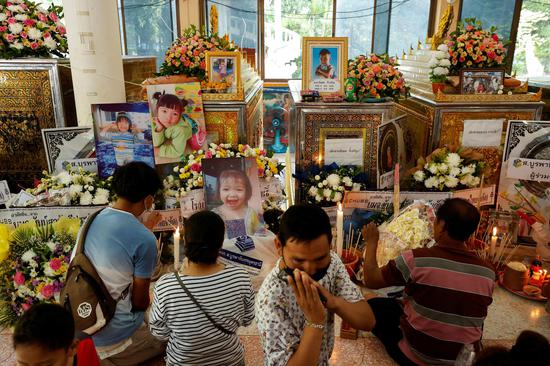 People mourn victims of childcare center mass shooting in Thailand