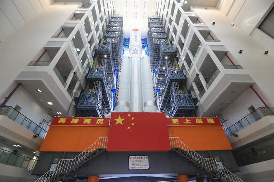 Photo taken on July 18, 2022 shows the combination of China's space station lab module Wentian and a Long March-5B Y3 carrier rocket to be transferred in south China's Hainan Province. (Photo by Tu Haichao/Xinhua)