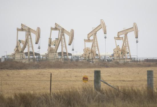 Oil derricks operate in Three Rivers, Texas, the United States on Feb. 24, 2022. (Photo by Nick Wagner/Xinhua)