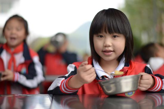 Students have a nutritious diet at a school in Suiyang County, southwest China's Guizhou Province, Oct. 12, 2021. (Xinhua/Yang Ying)