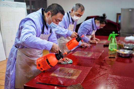 Restorers devoted to document protection in NE China