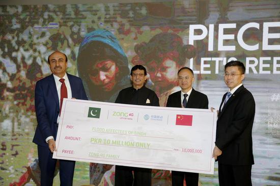 Chinese Ambassador to Pakistan Nong Rong (2nd R) and Pakistan's Minister of IT and Telecommunication Syed Amin Ul Haque (2nd L) attend a donation ceremony for flood-hit Sindh province, in Islamabad, Pakistan, on Oct. 20, 2022. (Xinhua/Ahmad Kamal)