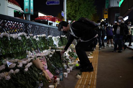 People mourn for victims of deadly stampede in South Korea