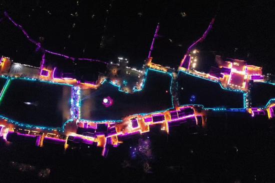 Colorful lights illuminate ancient village in Jiangxi