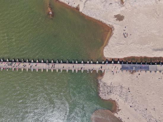Ancient pontoon bridge partially exposed due to drought in Jiangxi