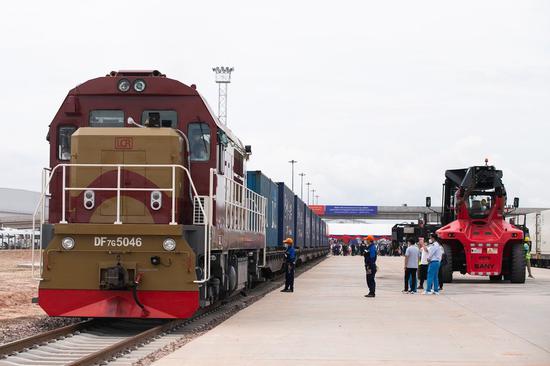 Cross-border goods are reloaded at a freight transit yard of China-Laos Railway's Vientiane South Station on July 1, 2022. (Photo by Kaikeo Saiyasane/Xinhua)