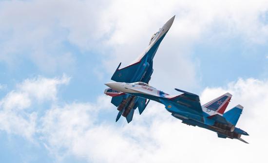 The Russian Knights aerobatic demonstration team perform during the closing day of the International Aviation and Space Salon (MAKS)-2021 in a Moscow suburb, Russia, on July 25, 2021. (Xinhua/Bai Xueqi)