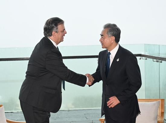 Chinese State Councilor and Foreign Minister Wang Yi meets with Mexican Foreign Affairs Minister Marcelo Ebrard while attending the Group of 20 Summit in Bali, Indonesia, Nov. 16, 2022. (Xinhua/Zhang Ling)