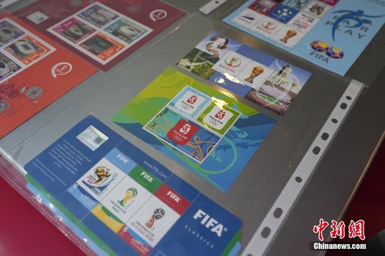 Commemorative stamps of 2008 Beijing Olympics on display at World Cup 2022