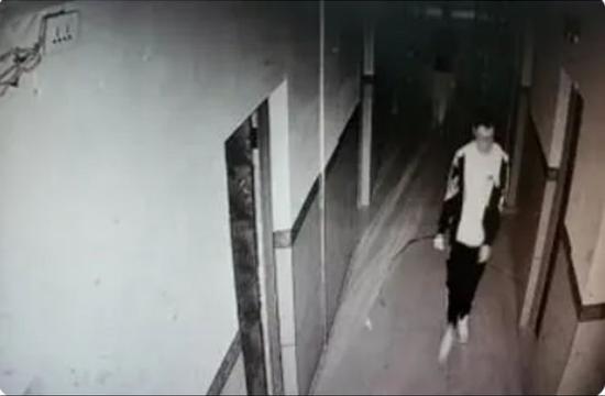 Surveillance video footage shows Hu Xinyu  was last seen in the school’s dormitory building at 5:48 p.m., Oct. 14. (Screenshot photo)