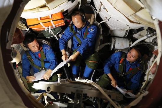 File photos of three taikonauts trained for Shenzhou-15 mission