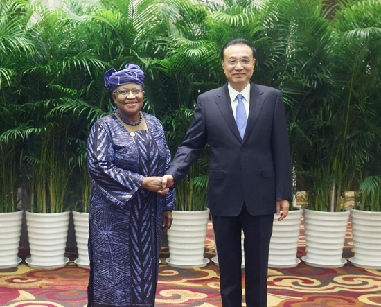 Chinese Premier Li Keqiang meets with World Trade Organization (WTO) Director-General Ngozi Okonjo-Iweala, who is in China for the seventh 